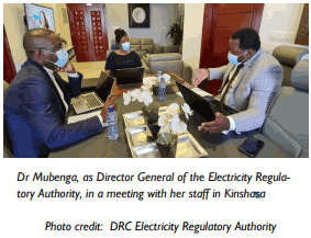 Dr. Mubenga, Director General of the Electricity Regulatory Agency for the DRC in Staff Meeting in Kinshasa